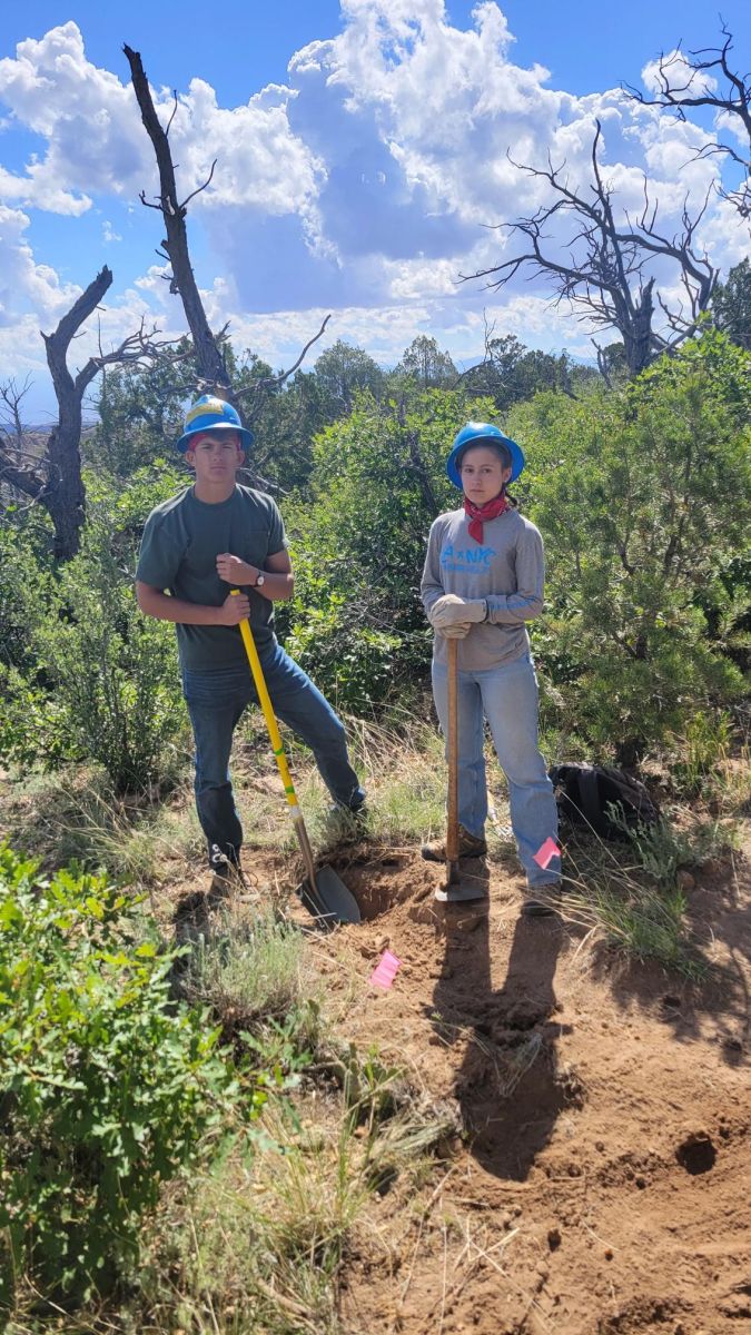 YCC crew working on a forest trail in a burn area
